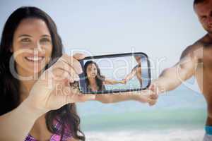 Couple taking selfie on smartphone