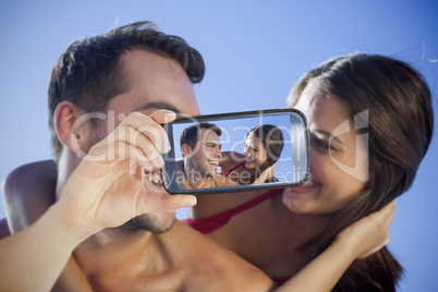 Couple taking selfie on smartphone