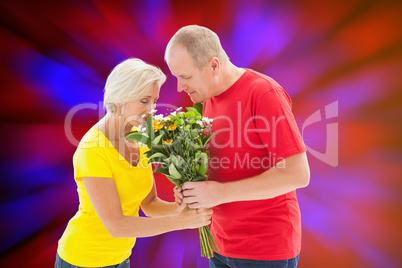 Composite image of mature man offering his partner flowers