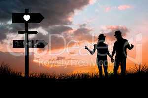 Composite image of happy couple walking holding hands