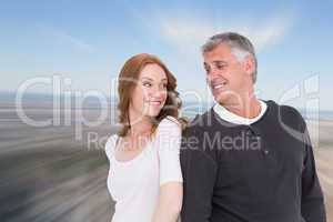 Composite image of casual couple smiling at each other