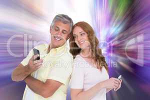 Composite image of casual couples on their phones