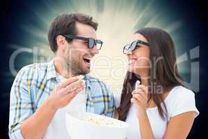 Composite image of attractive young couple watching a 3d movie