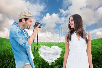 Composite image of handsome hipster taking a photo of pretty gir