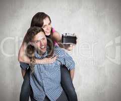 Composite image of couple taking selfie with digital camera