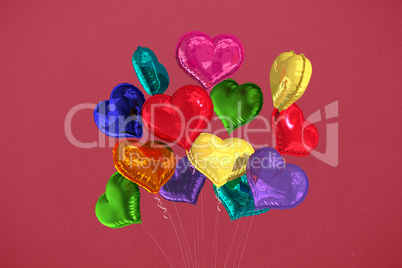 Composite image of heart balloons