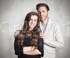 Composite image of portrait of smiling young couple