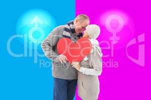 Composite image of happy mature couple in winter clothes holding