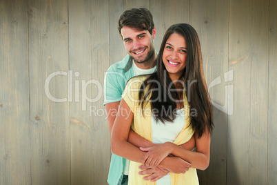 Composite image of happy casual couple smiling at camera