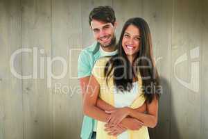 Composite image of happy casual couple smiling at camera