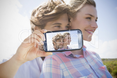 Couple taking selfie on smartphone