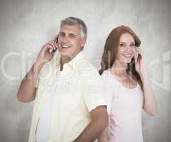 Composite image of casual couple on their phones