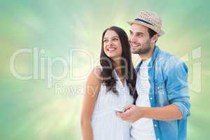 Composite image of happy hipster couple smiling together