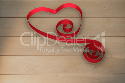 Large red ribbon in a heart shape