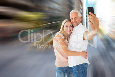 Composite image of happy couple posing for a selfie