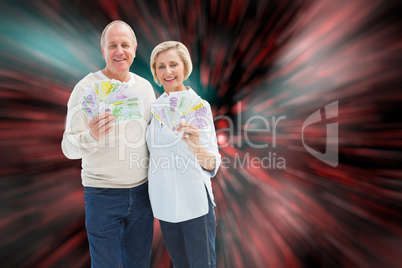 Composite image of happy mature couple smiling at camera showing