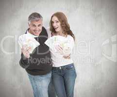 Composite image of casual couple showing their cash