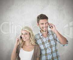 Composite image of attractive couple talking on their smartphone