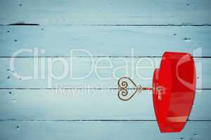 Bright red heart shaped lock with key