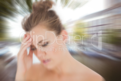 Composite image of woman with headache