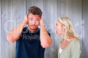 Composite image of man not listening to his shouting girlfriend