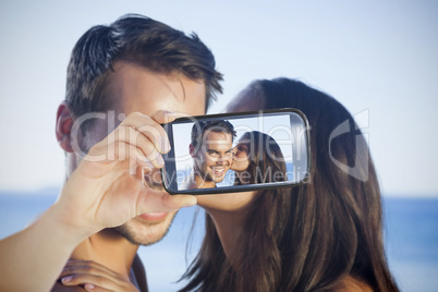 Couple taking selfie on smartphone