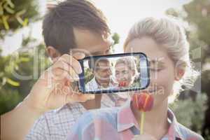 Couple taking selfie on smartphone