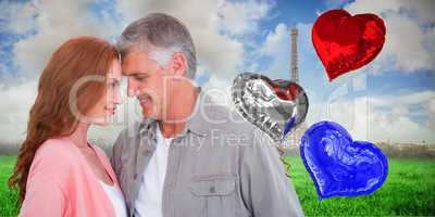 Composite image of casual couple hugging and smiling