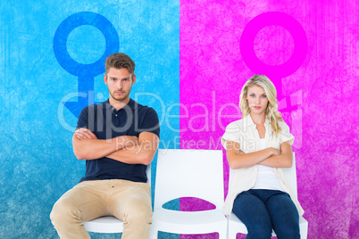 Composite image of young couple sitting in chairs not talking du