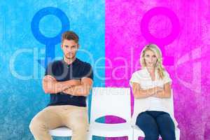 Composite image of young couple sitting in chairs not talking du