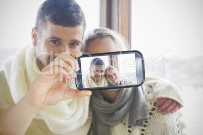 Couple taking selfie on smartphone