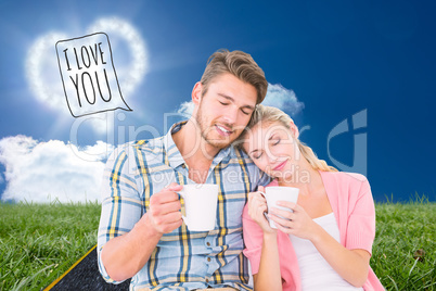Composite image of attractive young couple sitting holding mugs