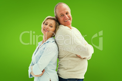 Composite image of mature couple standing and smiling at camera