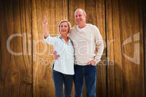 Composite image of happy mature couple walking together