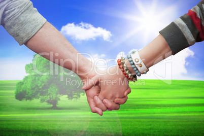 Composite image of students holding hands