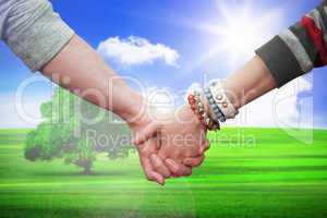 Composite image of students holding hands