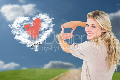 Composite image of attractive young blonde framing with her hand