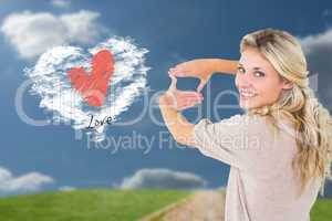 Composite image of attractive young blonde framing with her hand