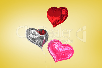 Composite image of love heart balloons