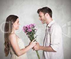 Composite image of side view of couple holding flowers