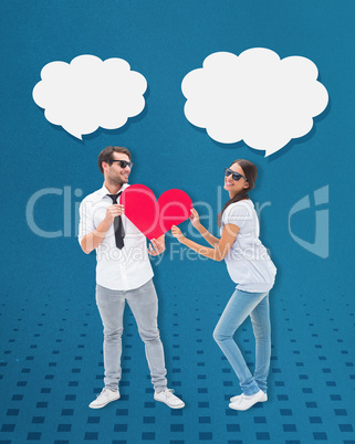 Composite image of hipster couple smiling at camera holding a he