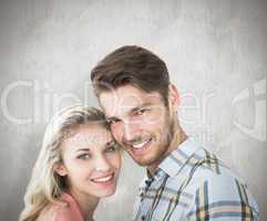 Composite image of attractive couple smiling at camera