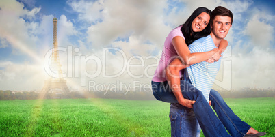 Composite image of young man giving girlfriend a piggyback ride