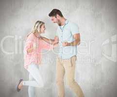 Composite image of attractive couple smiling and cheering