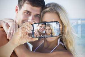 Couple taking selfie on smartphone