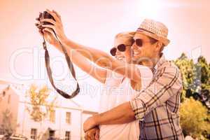 Stylish young couple taking a selfie