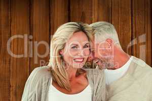 Composite image of happy couple laughing together woman looking