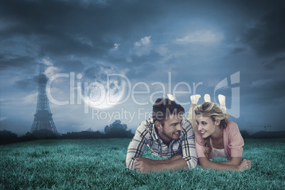 Composite image of attractive young couple smiling at each other