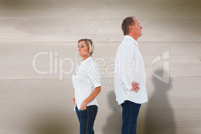 Composite image of upset couple not talking to each other after