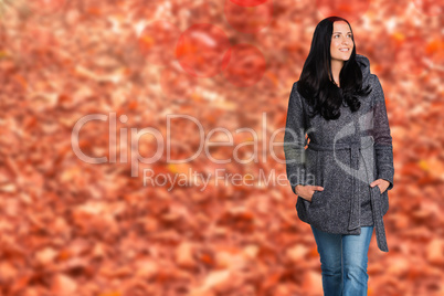 Composite image of woman standing and looking away